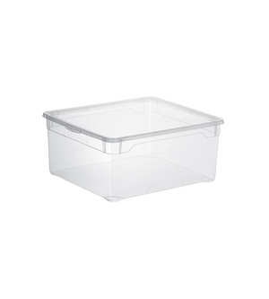 Doorzichtige plastic doos, leeg, staand in een neutrale ruimte op een glad oppervlak.