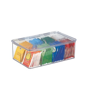 De theezakjesdoos bevat kleurrijke theezakjes, gesorteerd en netjes gerangschikt op doorzichtig plastic.