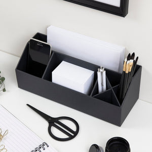 Deze bureau-organizer biedt ruimte voor je smartphone, papier, pennen en een schaar op kantoor.